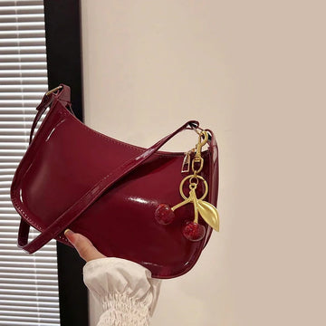 Saashi Women's PU Leather Versatile Fashion Solid Color Cherry Pendant Underarm Bag.